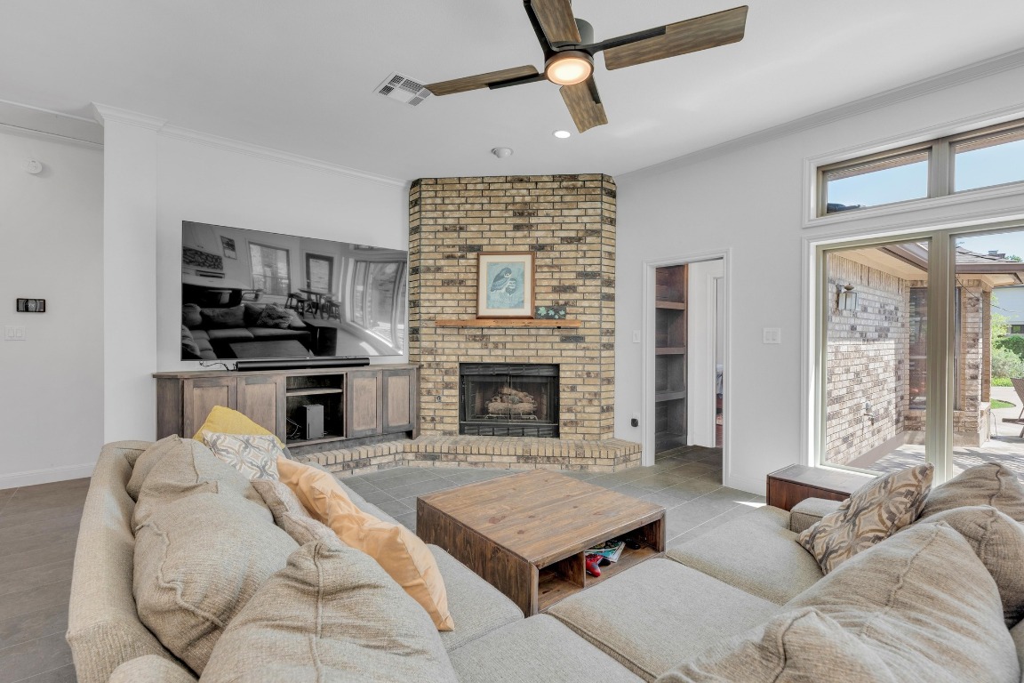 2 Meandering Way Round Rock, TX 78664 - Photo 9 of 39 a living room with furniture and a fireplace