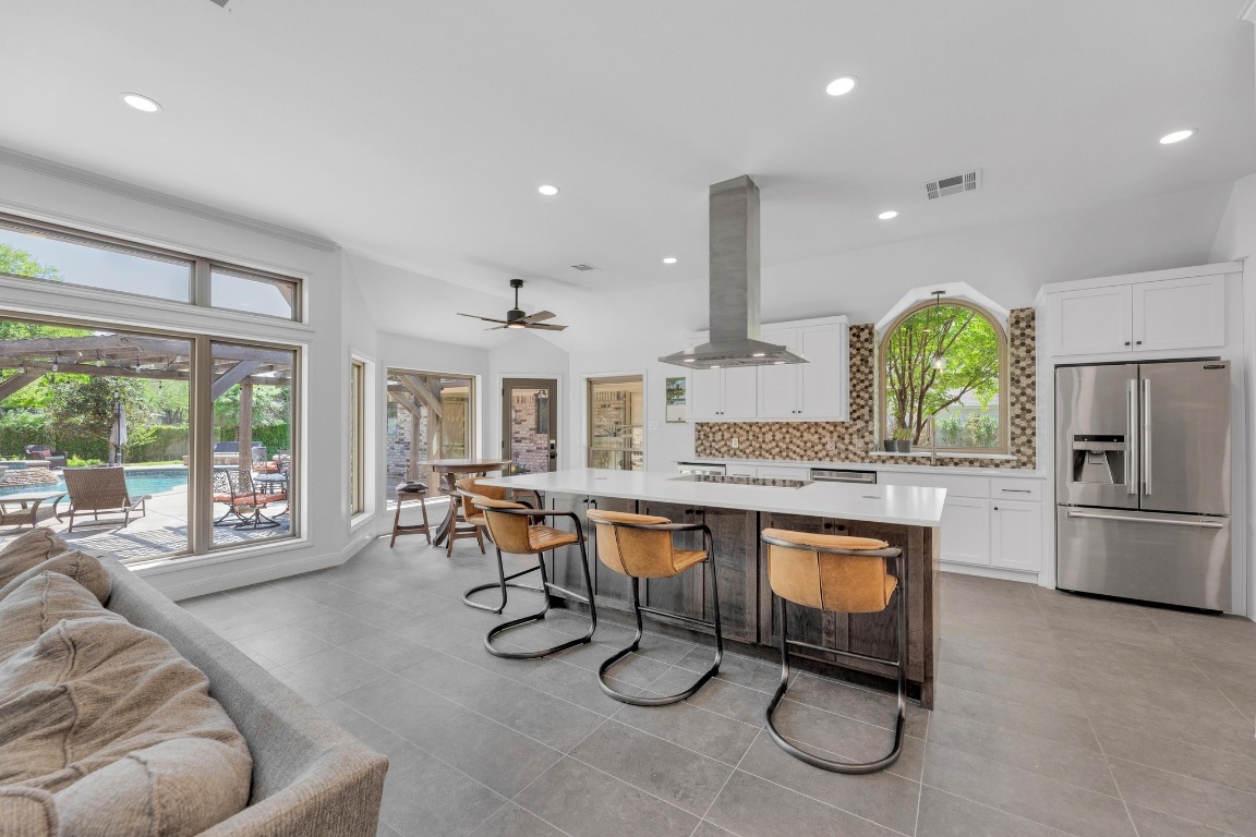 2 Meandering Way Round Rock, TX 78664 - Photo 10 of 39 a kitchen with stainless steel appliances granite countertop a stove and a refrigerator