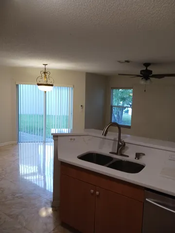 a kitchen with a sink and a window