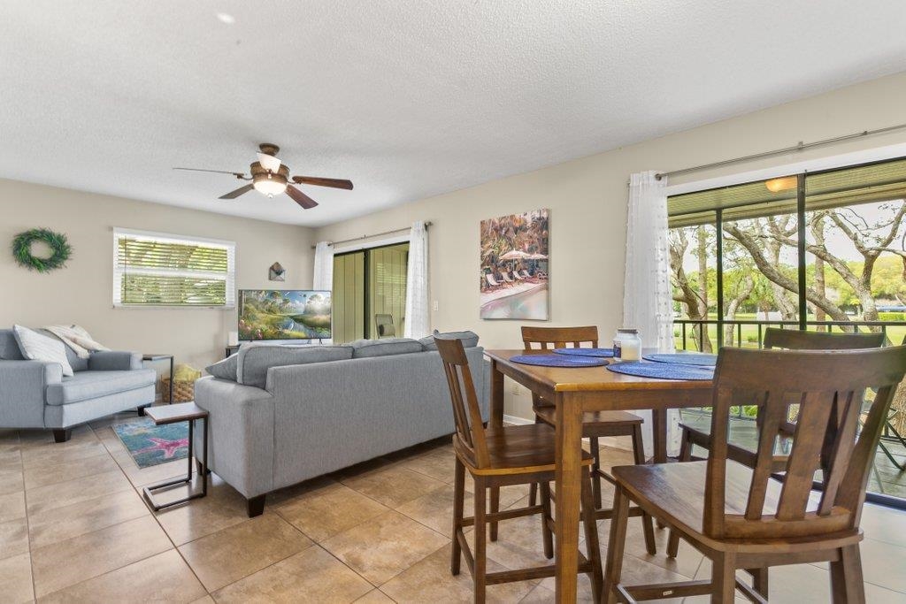 2 Cartagena Court St. Augustine, FL 32086 - Photo 11 of 49 a view of a dining room with furniture a couch and wooden floor