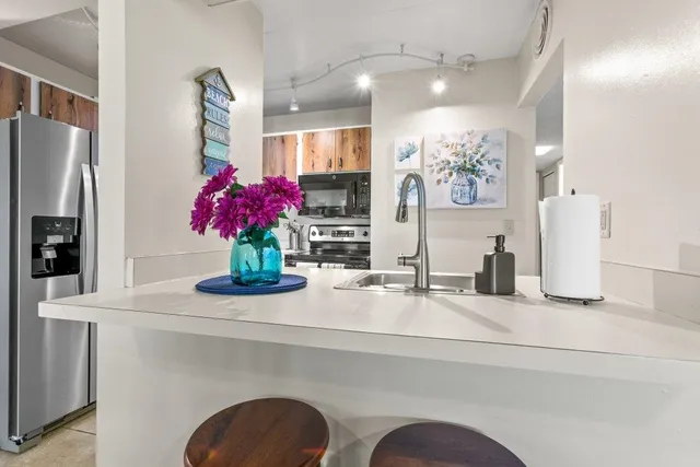 a view of balcony with furniture