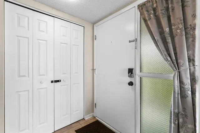 a view of a hallway with washer and dryer