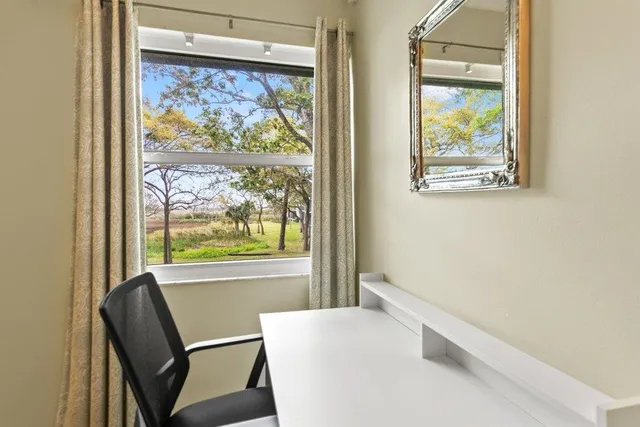 a bedroom with a bed and a table