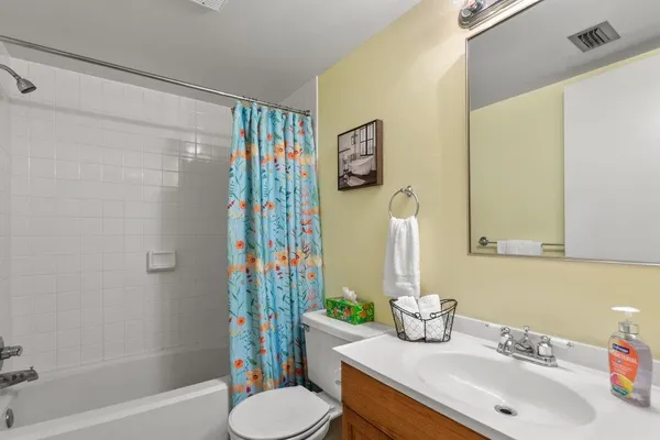 a bedroom with two beds and a window