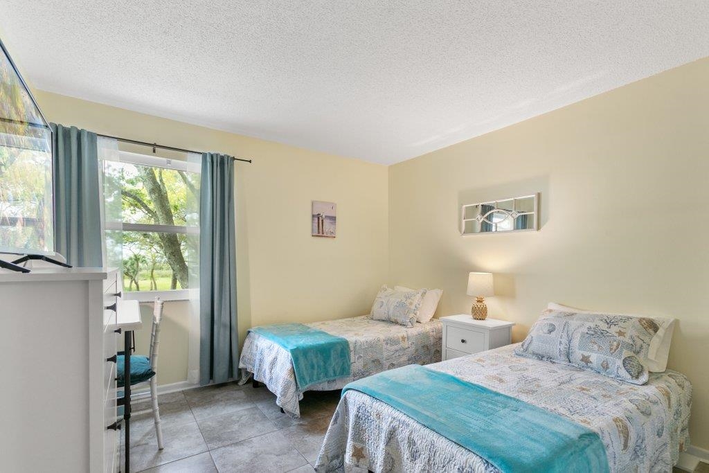 2 Cartagena Court St. Augustine, FL 32086 - Photo 30 of 49 a bedroom with two beds and a window