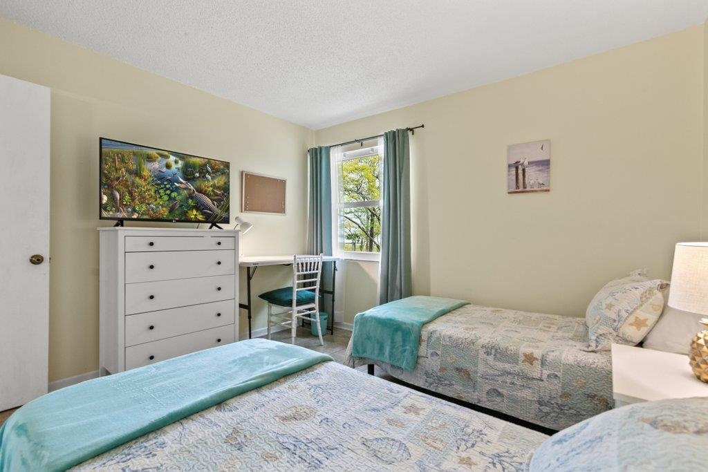 2 Cartagena Court St. Augustine, FL 32086 - Photo 31 of 49 a bedroom with a bed and a television