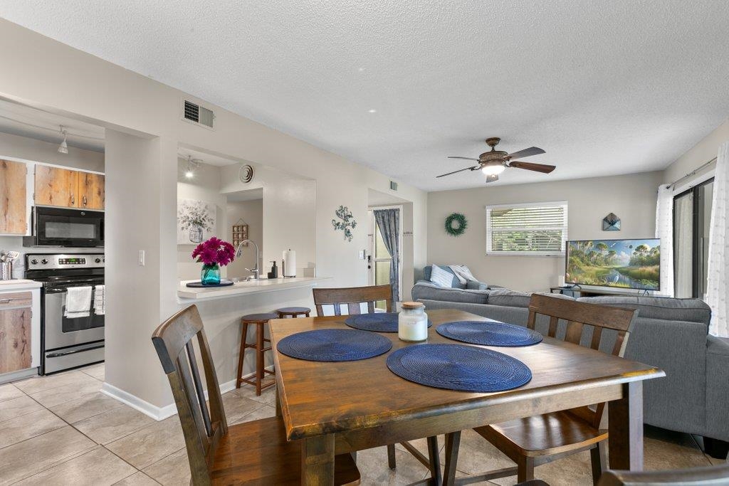 2 Cartagena Court St. Augustine, FL 32086 - Photo 10 of 49 a view of a dining room with furniture and a chandelier