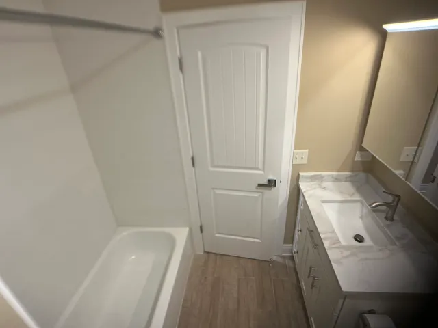 a bathroom with a sink a toilet and vanity