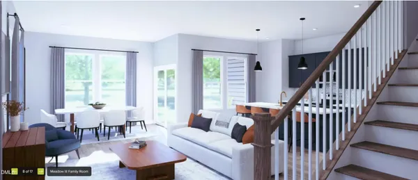 a living room with furniture and floor to ceiling windows