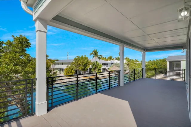 a view of a kitchen with a sink and a refrigerator