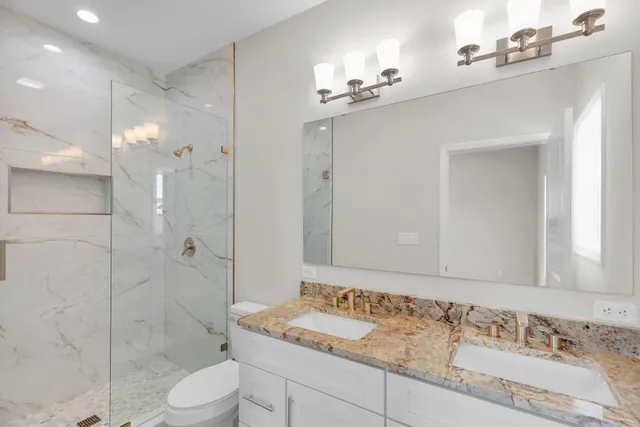 an empty room with cabinet and windows