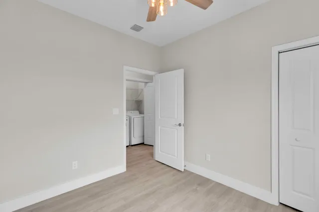 a bathroom with a granite countertop sink a toilet and bathtub