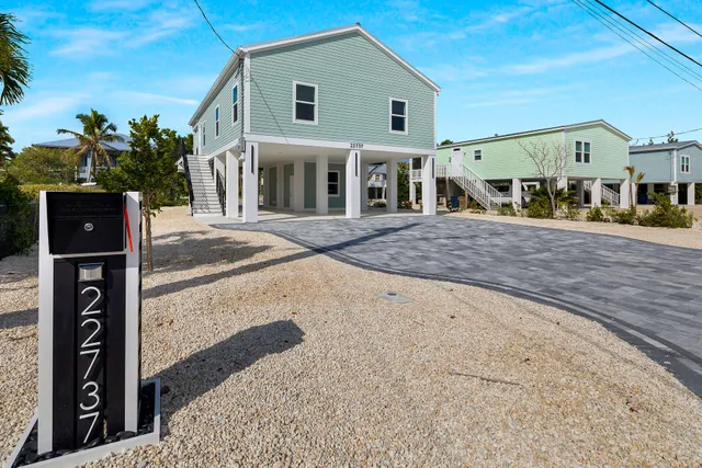 a front view of a house with a porch