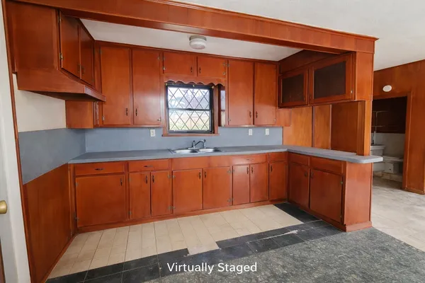 a kitchen with stainless steel appliances granite countertop wooden cabinets a sink and dishwasher