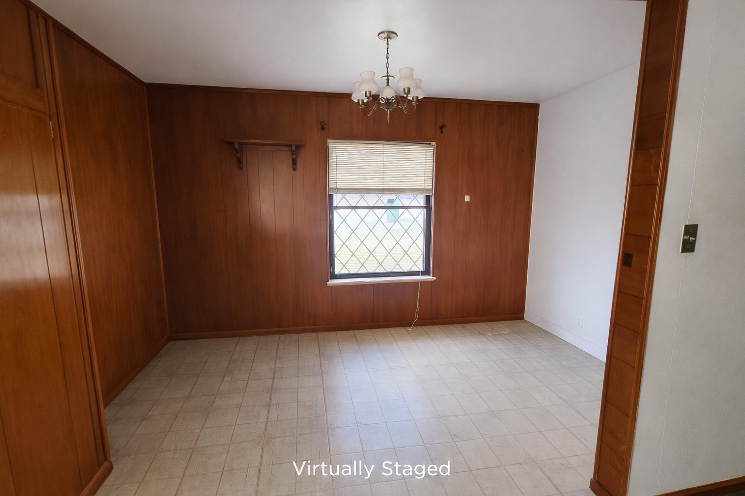 7822 Kimble Street Houston, TX 77017 - Photo 5 of 11 an empty room with windows and chandelier