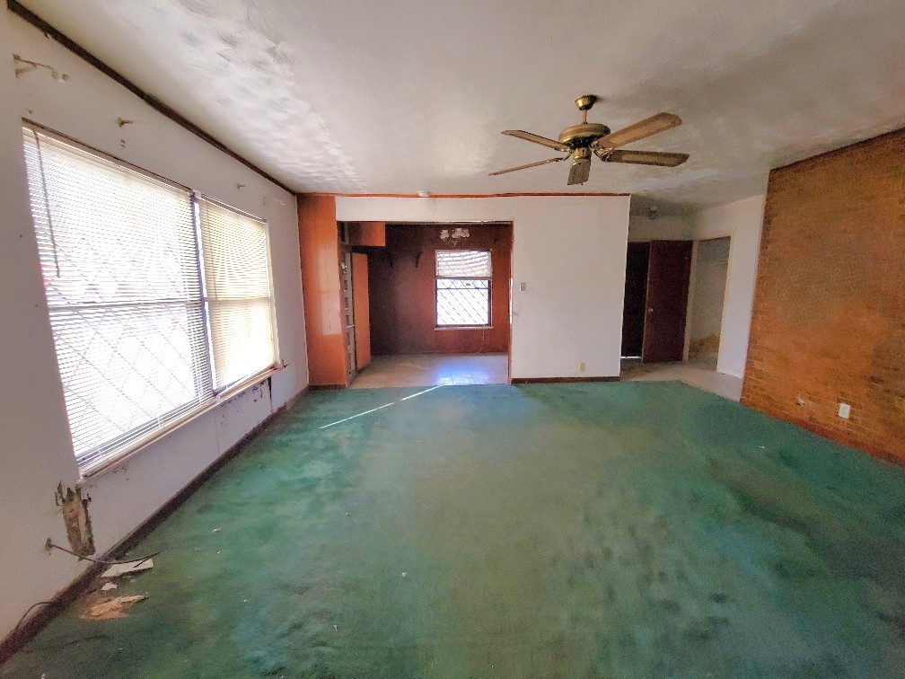 7822 Kimble Street Houston, TX 77017 - Photo 6 of 11 a view of a livingroom with a ceiling fan and window