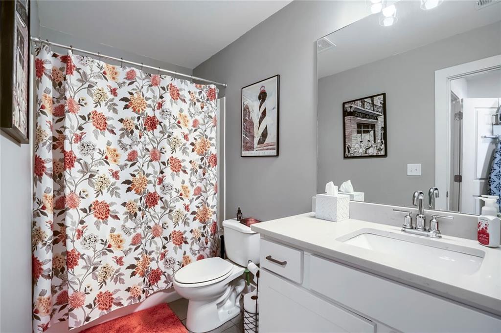 76 Garrison Drive Winder, GA 30680 - Photo 15 of 26 a bathroom with a sink toilet and a mirror