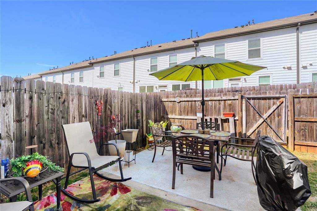 76 Garrison Drive Winder, GA 30680 - Photo 23 of 26 a view of a chairs and table in the patio