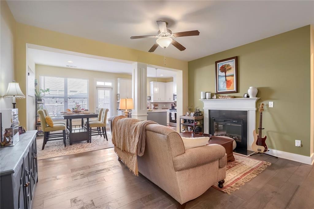 76 Garrison Drive Winder, GA 30680 - Photo 5 of 26 a living room with furniture fireplace and a table