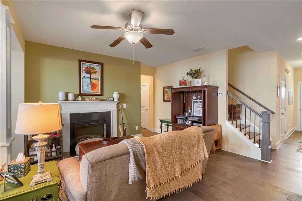 76 Garrison Drive Winder, GA 30680 - Photo 7 of 26 a living room with furniture and a fireplace