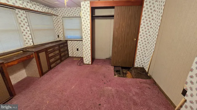 an empty room with windows