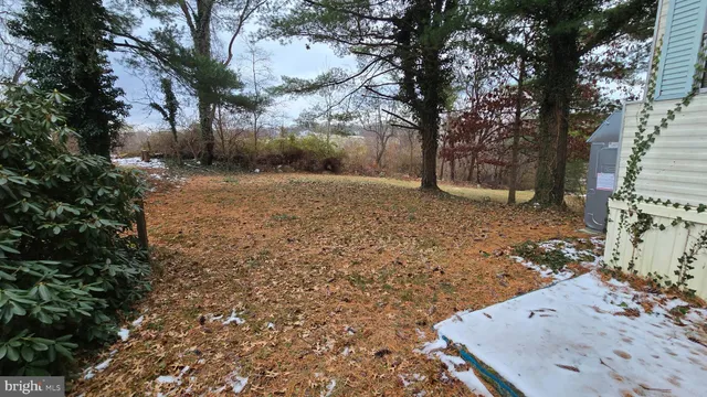 a view of a yard covered with snow