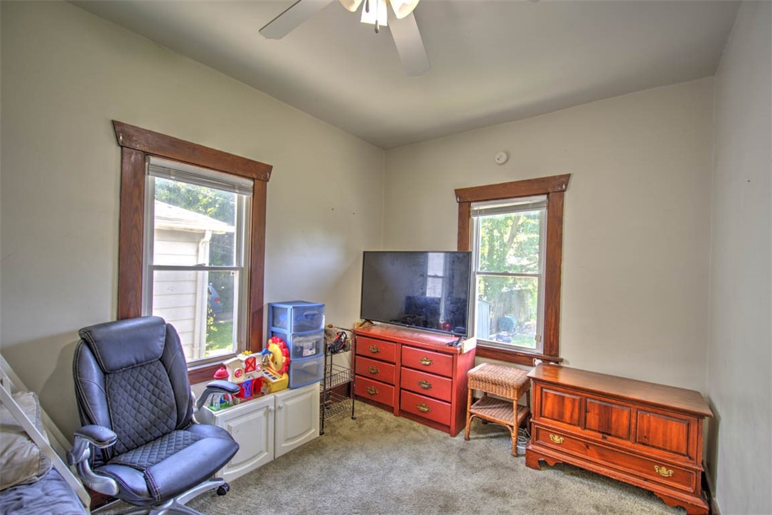 739 West Cushing Street Decatur, IL 62526 - Photo 18 of 28 a living room with furniture and a flat screen tv