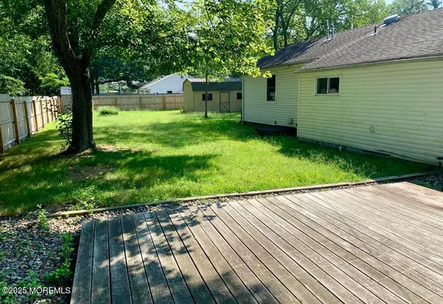 a view of backyard with a garden and plants