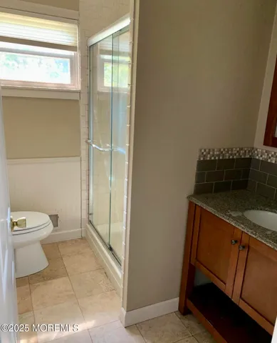 a bathroom with a sink and a toilet