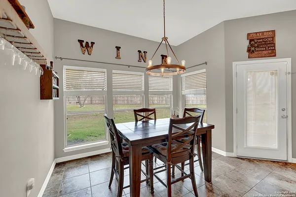a view of a dining room with furniture window and outside view