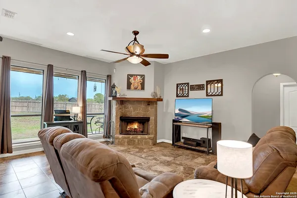 a living room with furniture a fireplace