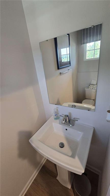 12 Downing Drive Adairsville, GA 30103 - Photo 18 of 36 a bathroom with a sink a mirror and a toilet