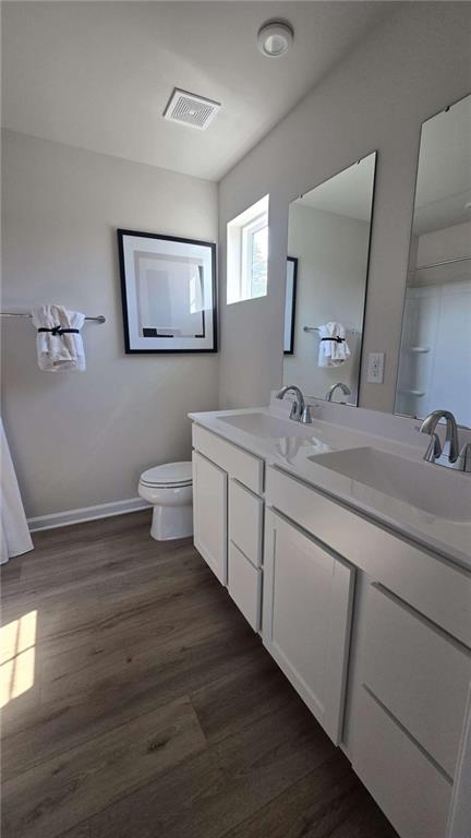 12 Downing Drive Adairsville, GA 30103 - Photo 19 of 36 a spacious bathroom with a double vanity sink and a mirror