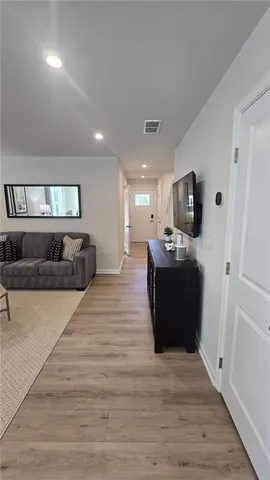 an empty room with closet and windows