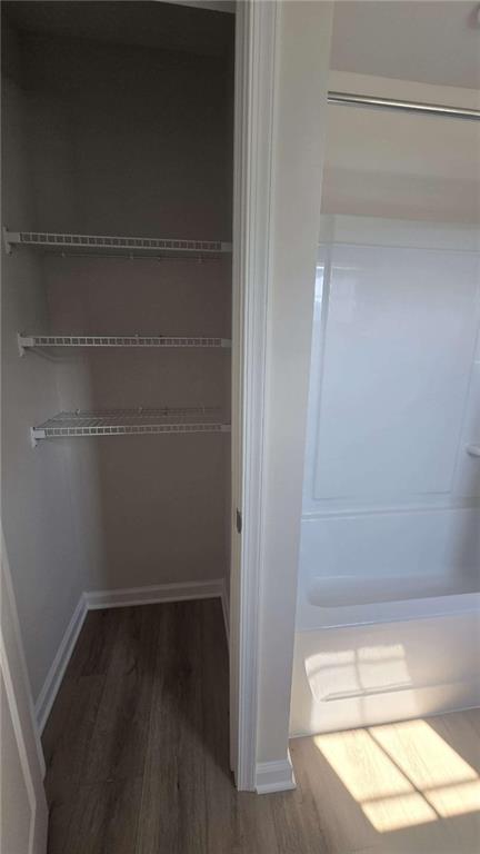 12 Downing Drive Adairsville, GA 30103 - Photo 29 of 36 a view of walk in closet with empty racks