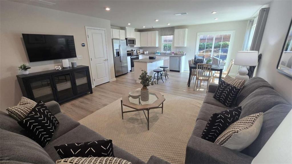 12 Downing Drive Adairsville, GA 30103 - Photo 30 of 36 a living room with furniture and a flat screen tv