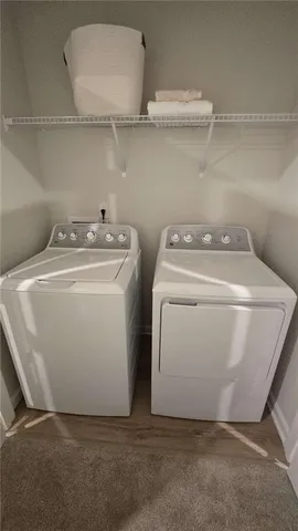 a utility room with dryer and washer