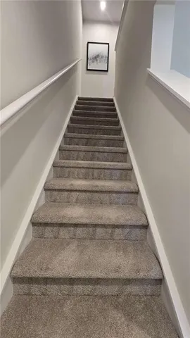 a bathroom with a toilet sink and vanity
