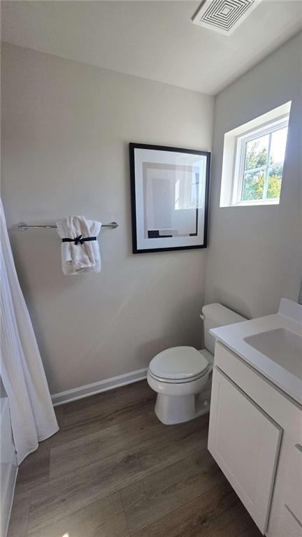 12 Downing Drive Adairsville, GA 30103 - Photo 6 of 36 a bathroom with a toilet sink and vanity