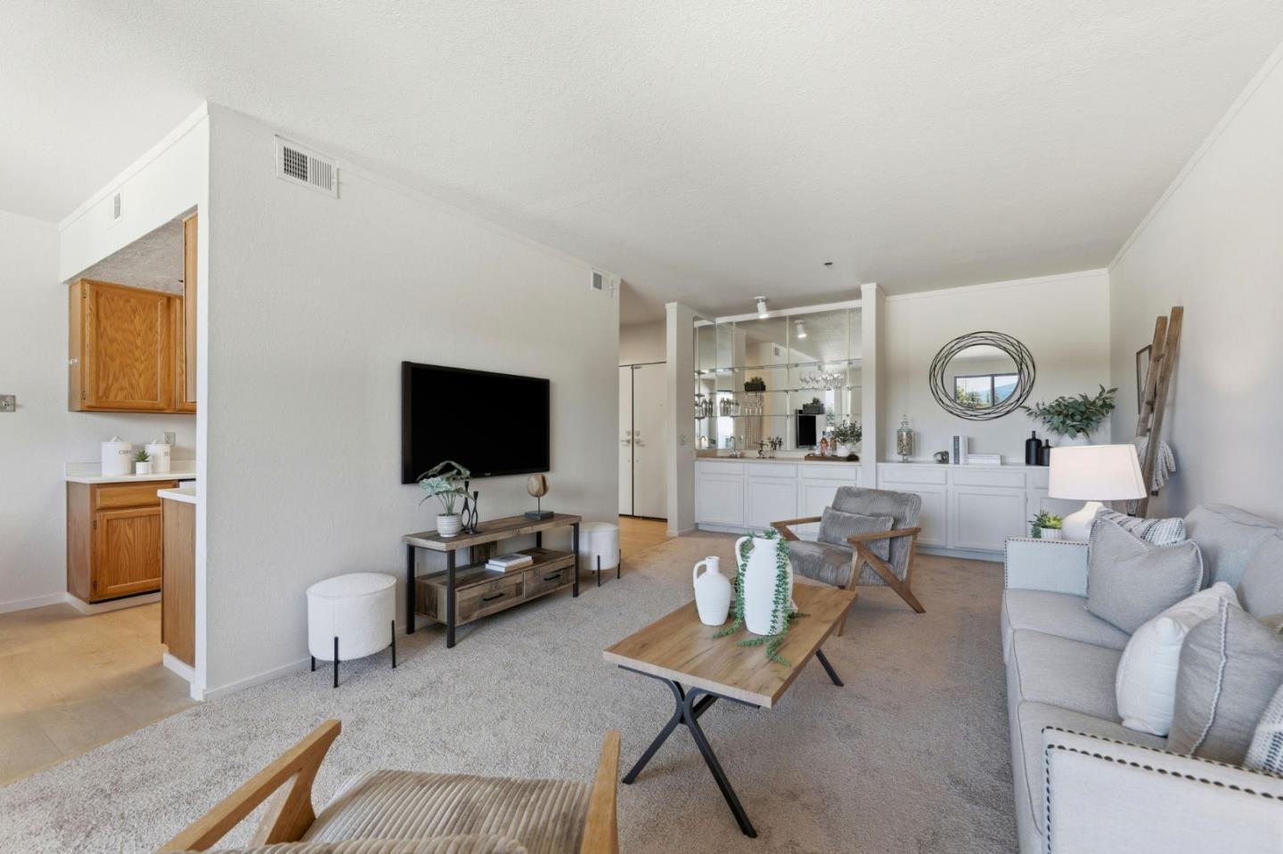 22330 Homestead Road, Unit 226 Cupertino, CA 95014 - Photo 7 of 38 a living room with furniture and a flat screen tv