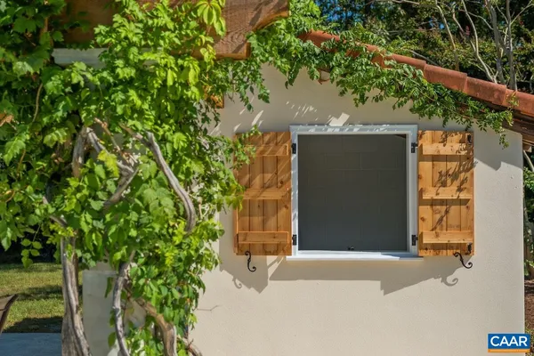 a view of a room with wooden floor and stairs