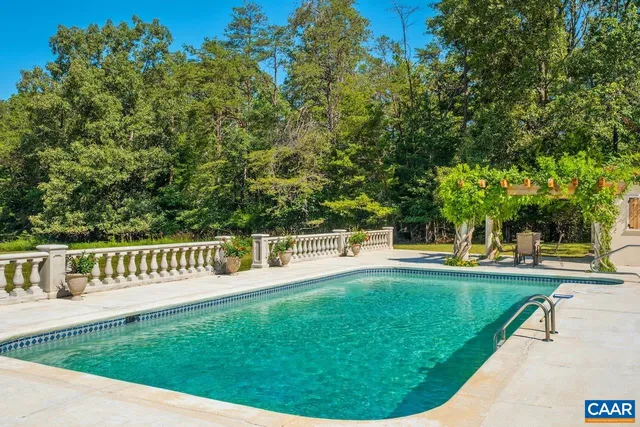 a view of empty room with wooden floor and fireplace