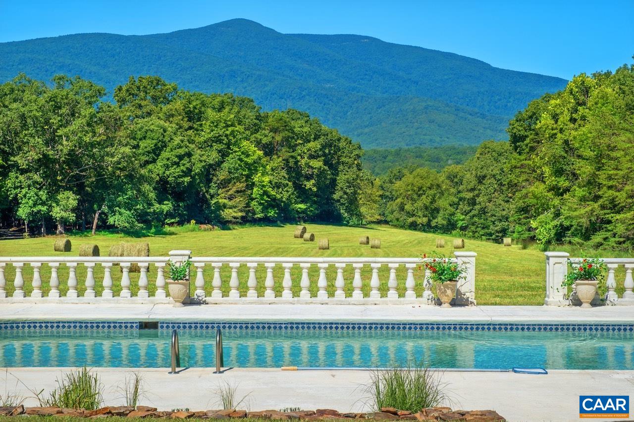 8540 Taylor Creek Road Afton, VA 22920 - Photo 18 of 71 a view of swimming pool with large trees and a fence