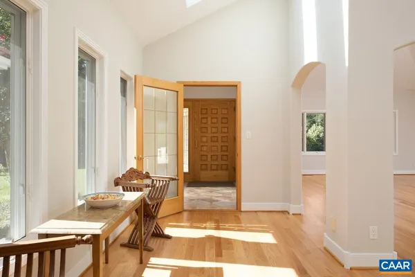 a kitchen with stainless steel appliances granite countertop a sink and a white cabinets