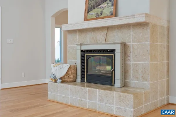 an empty room with large windows