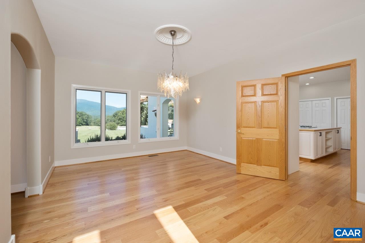 8540 Taylor Creek Road Afton, VA 22920 - Photo 28 of 71 a view of an empty room with window and wooden floor