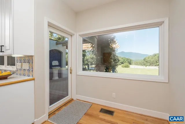 a bathroom with a granite countertop toilet sink and mirror