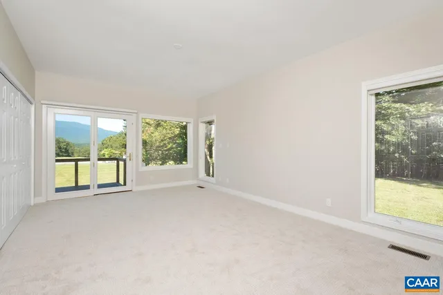 an empty room with a empty space and window