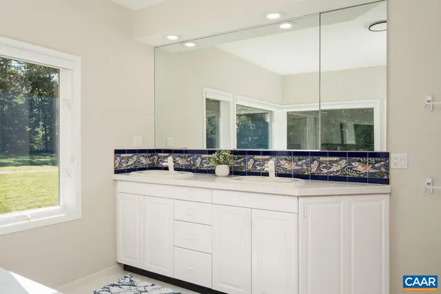 a view of an swimming pool with seating area