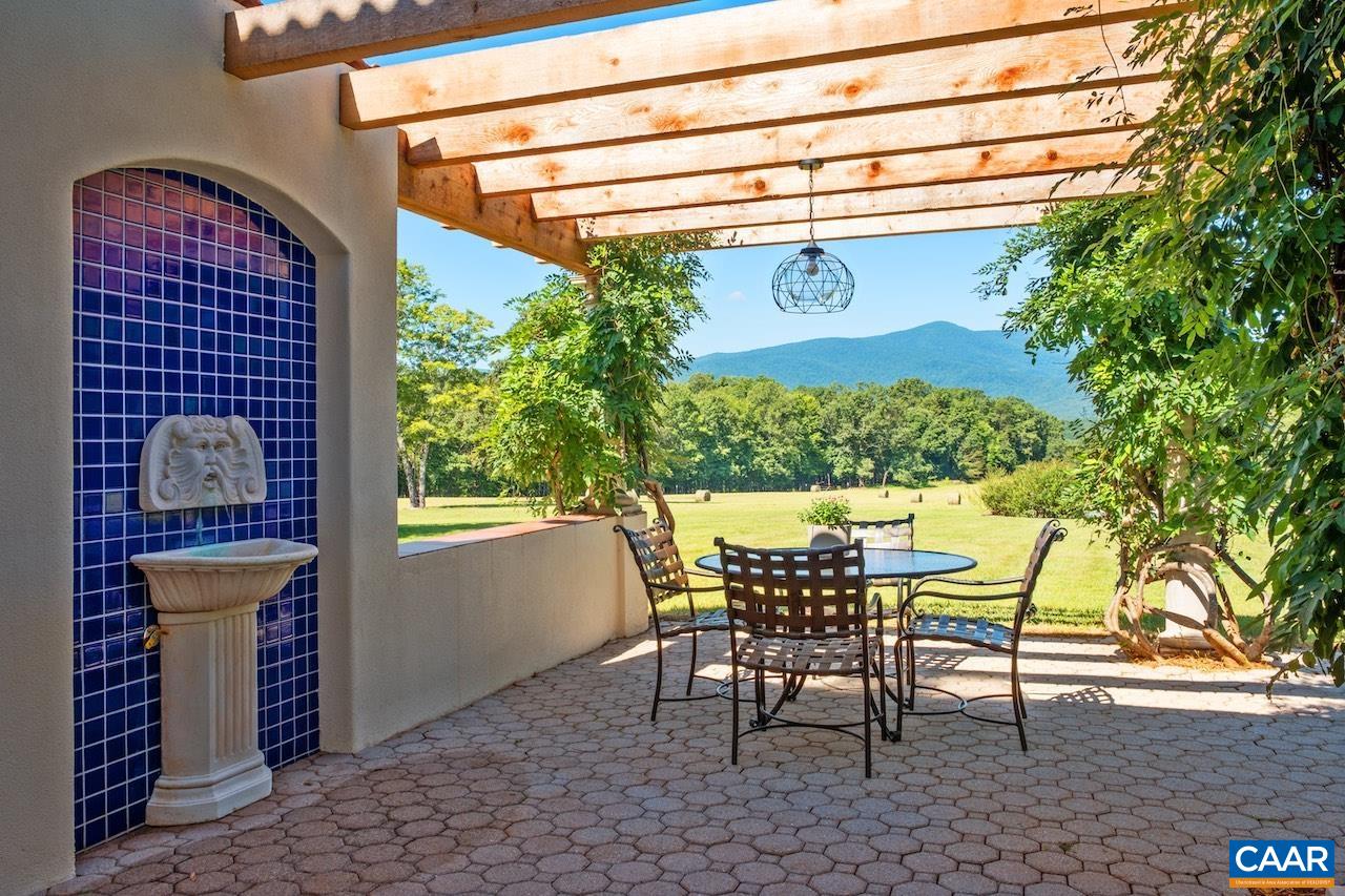 8540 Taylor Creek Road Afton, VA 22920 - Photo 7 of 71 a table and chairs in front of a door